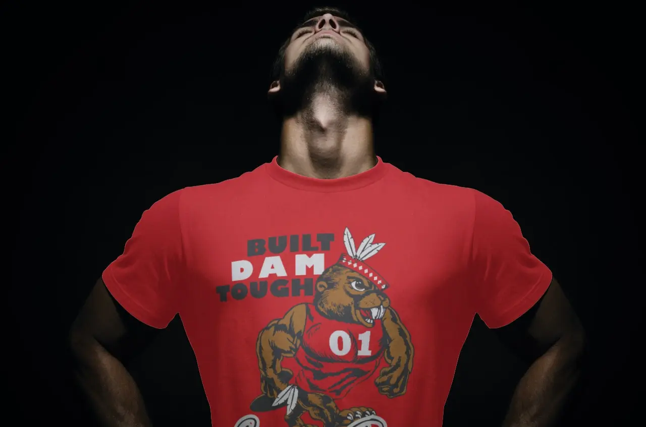 Man wearing Beaver Dam fan shirt, looking up